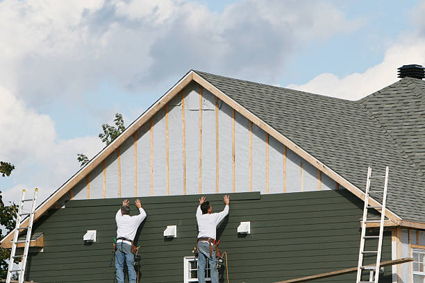 Professional Siding technician working in Newtonville, MA
